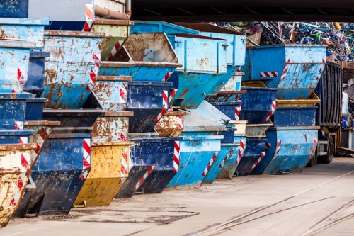 Family decluttering their home with a skip in the garden