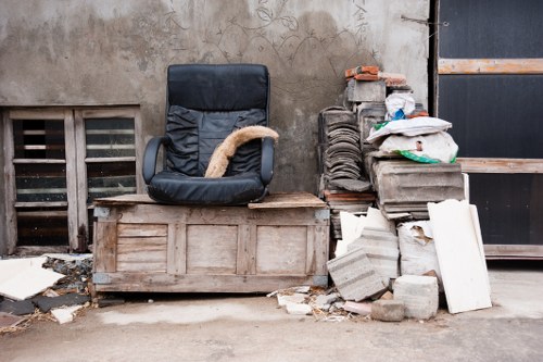 Person placing a skip on the side of a property in Enfield